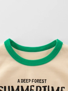 Kids cotton t-shirt with green ribbed neckline and forest-themed letter print