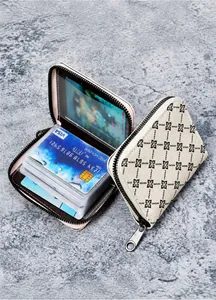 Macro detail of cream floral card holder wallet with multiple slots and zip closure