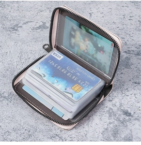 Detailed view of the pink leather multi-card holder with secure zipper and transparent slots
