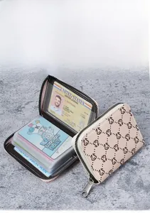 Detail of multi-slot card holder with transparent PVC windows and zipper closure