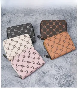Litchi pattern multi-color leather wallets with zip closure shown on stone background