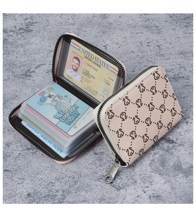 Detail of accordion card slots and ID window in pink monogram leather wallet