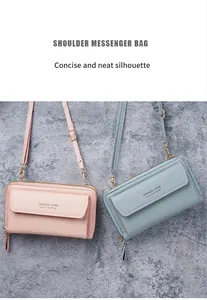 Detail view of pink and blue faux leather shoulder bags on a marble surface