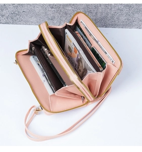 Pink multi-compartment phone wallet with dual zippers and textured leather detail