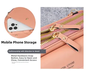 Detail of pink crossbody bag showing dual zippers and a dedicated front phone pocket