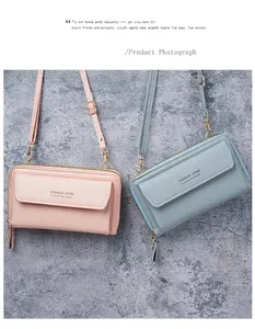 Close-up of pink and blue faux leather crossbody phone bags with double zipper details