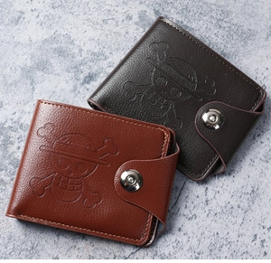 Detail of bifold wallets with embossed anime logo and metallic snap button closure