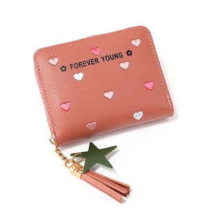 Red long zip-around wallet for women with embroidered hearts and tassel star charm