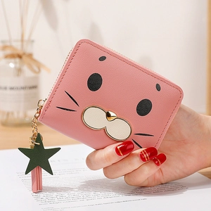 Pink cartoon seal zipper wallet for women with cute star charm and tassel detail