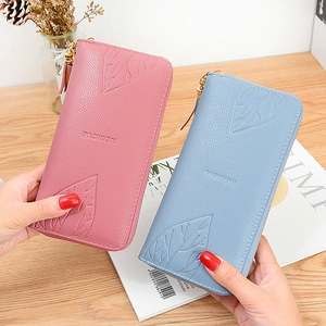 Pink and blue long zipper wallets with leaf relief patterns and leather tassels