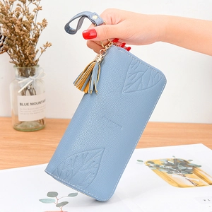Light blue faux leather long wallet for women featuring leaf pattern and fringe tassel