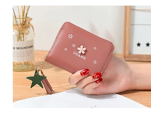 Pink mini flower wallet with golden zipper, leather star charm and long tassel detail