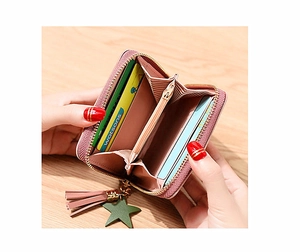 Pink PU leather folding coin purse with star pendant and tassel showing interior card slots