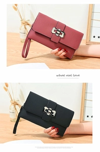 Detail of litchi texture women's long wallets with metal clasps and wrist straps