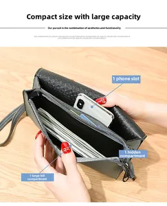 Detailed view of grey pebble leather wallet with phone pocket and cash compartments