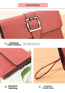 Detail view of brick red leather crossbody bag with high-quality litchi grain texture