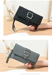 Detail of lychee pattern leather clutch bags in black and grey-blue with silver buckles
