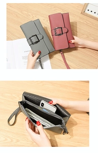 Detail of multi-compartment leather wallet showing card slots and large bill pocket