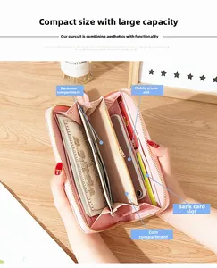 Pink faux leather long wallet detail showing spacious multi-slot card and phone interior
