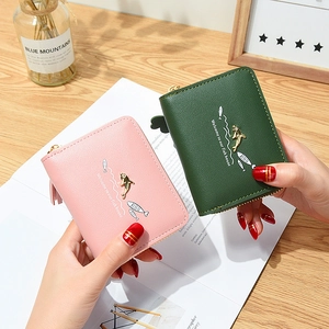 Cute short PU leather women's wallets with dolphin metal buckle and tassel in pink and green