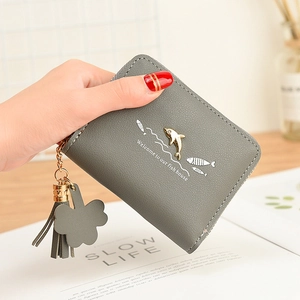 Short grey women's wallet with cute dolphin logo, tassel charm, and zipper closure