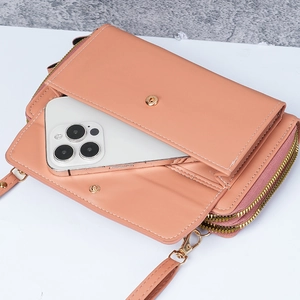 Peach pink faux leather crossbody phone bag with dual zippers and gold hardware detail