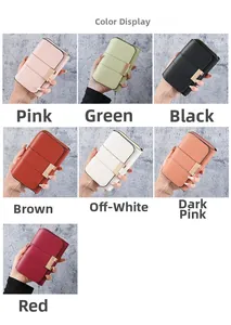 Detail view of stylish women's short wallet showing multiple colors and metal snap closure
