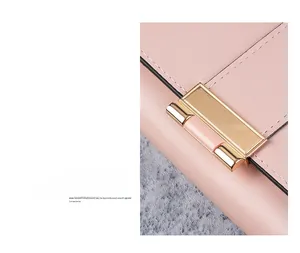 Detail of premium gold metal buckle on pink leather wallet with precision stitching