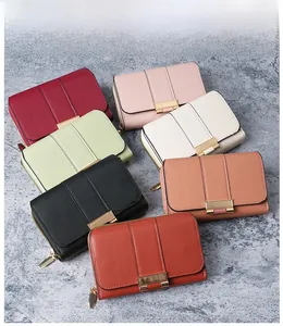 Short PU leather women wallets showing various colors and golden metal hardware buckles