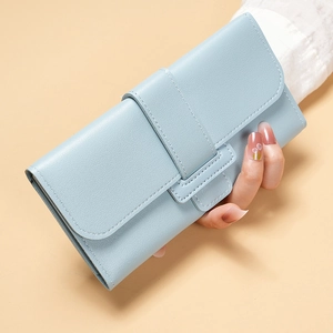 Close-up of light blue trifold leather wallet with textured cross-grain and metal buckle