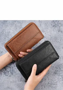 Detail view of large capacity men's business clutch wallets in black and brown leather