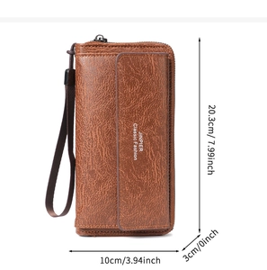 Detail view of large capacity brown leather clutch bag with card slots and wrist strap