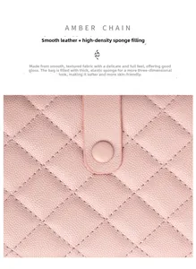 Detail of pink quilted leather passport holder with snap closure and soft padding