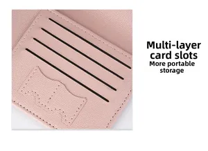 Detailed close-up of pink litchi leather passport wallet featuring multiple card slots