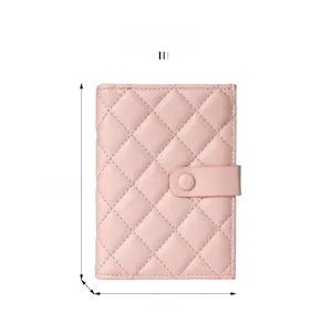 Pink quilted passport holder with snap closure and dimensions 15.5cm by 11cm by 2cm