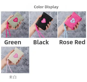 Mini heart wallets in green, black, pink and cream white with woven lanyards