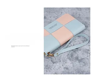 Close-up of long patchwork wallet featuring litchi grain texture and detachable wrist strap