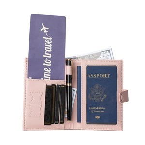 Pink lychee texture passport wallet with multiple card slots and secure snap closure
