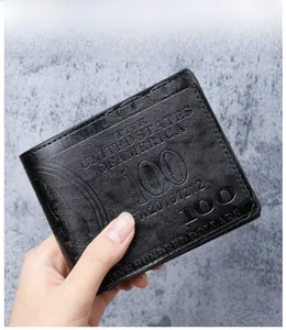 Detail of 100 dollar bill embossed pattern on black faux leather men's bi-fold wallet