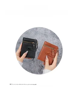 Detail of lychee pattern PU leather on mini zip wallets with snap buttons and stitching