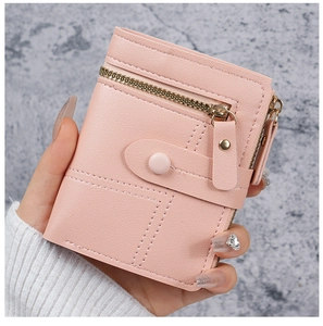 Detail view of pink PU leather wallet showing precision stitching and zipper closure