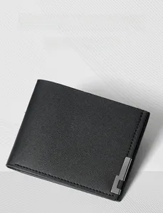 Macro view of black litchi grain leather wallet with silver metal edge and stitching
