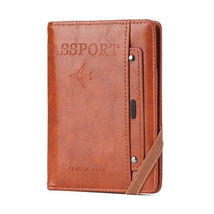 Brown faux leather passport holder with lychee pattern and elastic strap closure