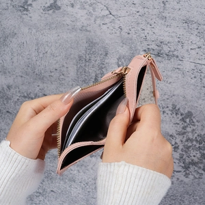 Pink short bifold wallet with gold zipper and pebble leather texture for women