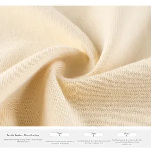 Macro detail of soft rib-knit cotton fabric and textile safety category standard chart