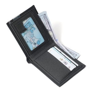 Black leather bifold wallet with metal money clip and multiple card slots on white background