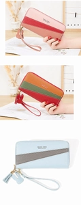 Detail of long zipped wallets with pebbled faux leather and fringed tassel charms