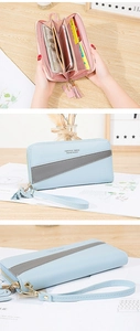 Detailed interior of women's long zipper wallet showing card slots and phone pocket