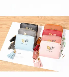 Short zipper wallets with metal leaf decor and bunny tassels in seven vibrant colors