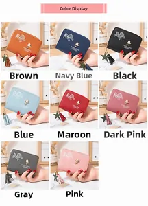 Detail view of mini PU leather wallets featuring star tassels and elegant embossed patterns